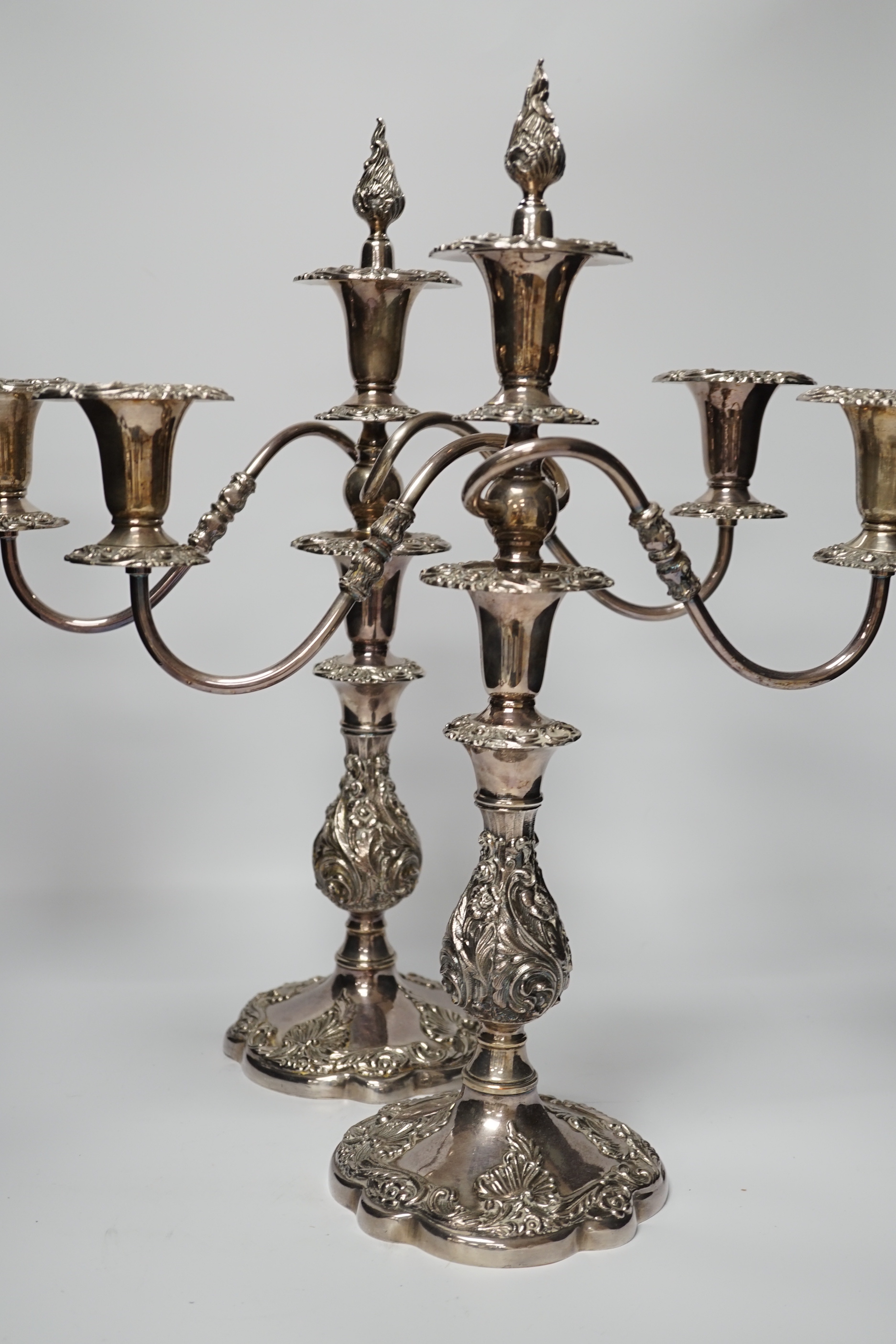 Two silver plated two branch three light candelabra, 49cm high